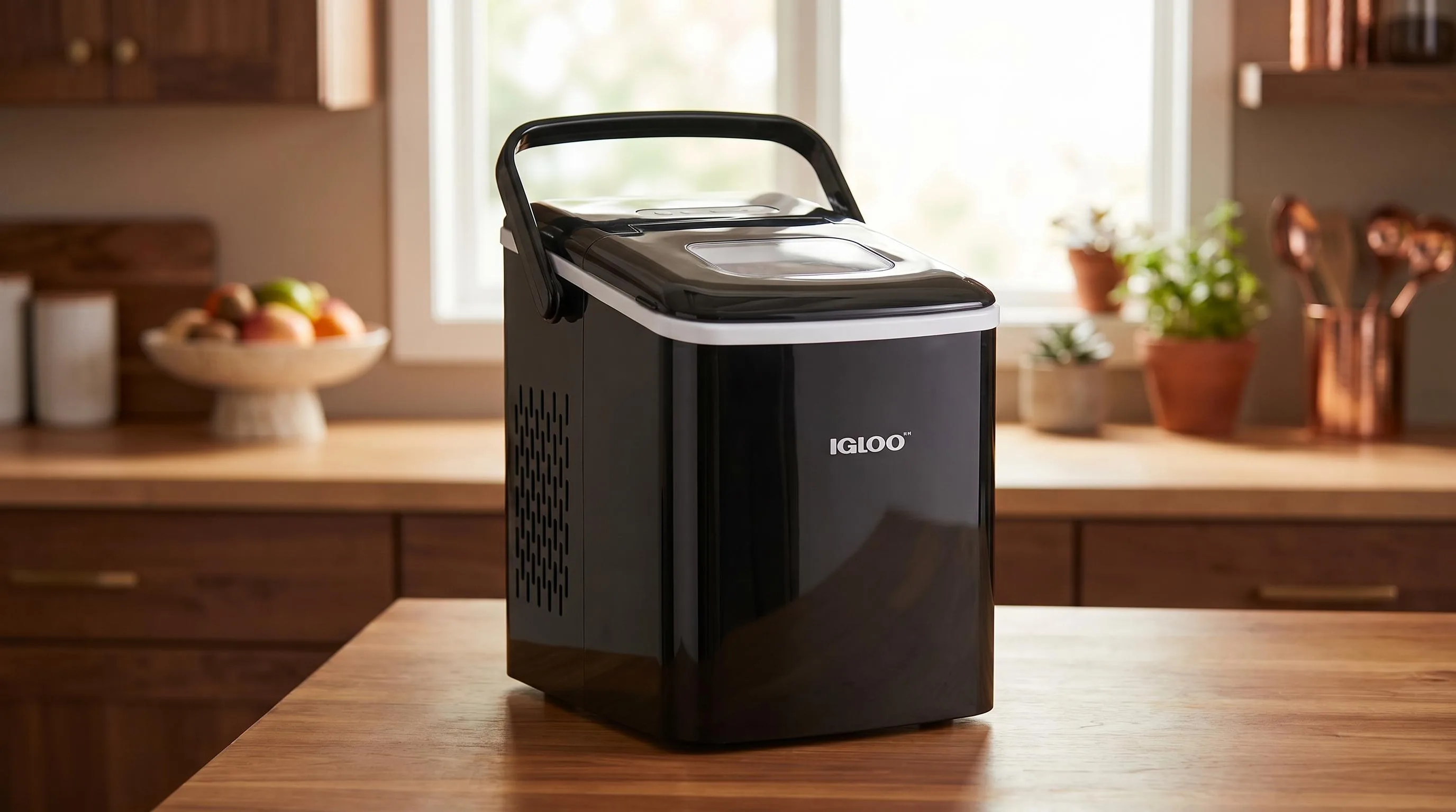 Top 10 The Best Portable Ice Maker in 2026 of All Time 18 Igloo ICEB26HNBK: Stylish black self-cleaning countertop ice maker with handle for portability