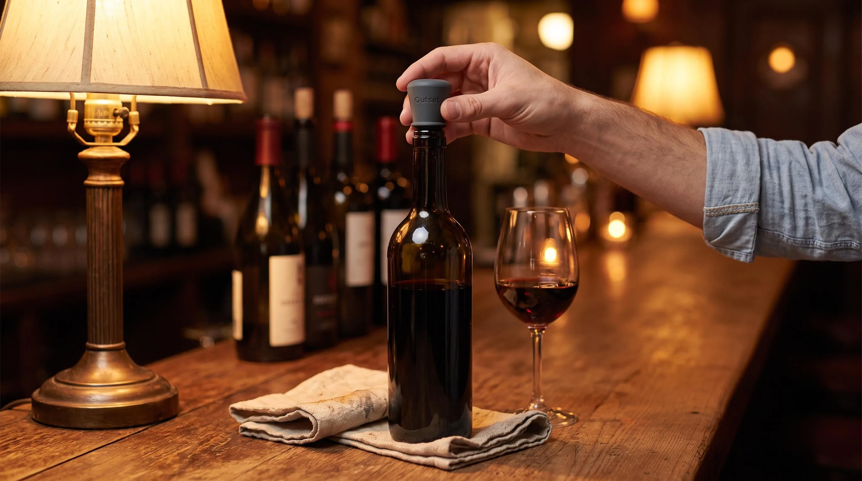 The Outset Silicone Wine Bottle Stoppers shown in everyday use at home, as tested by FlightWineBar