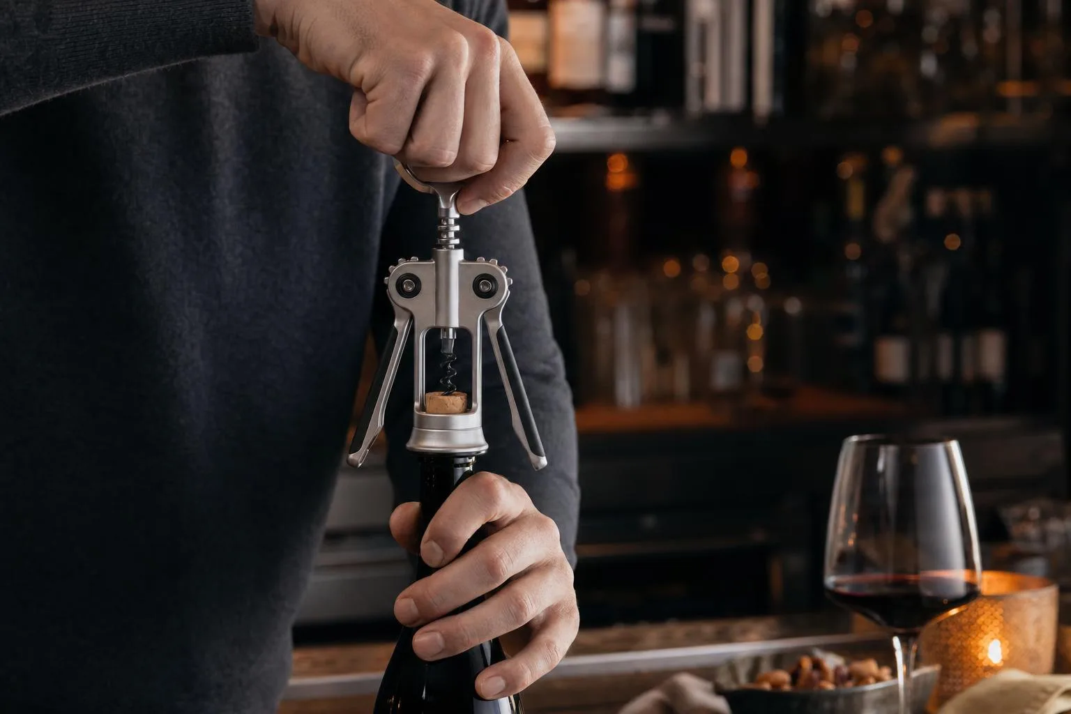 The OXO Steel Double Lever Corkscrew shown in everyday use at home, as tested by FlightWineBar